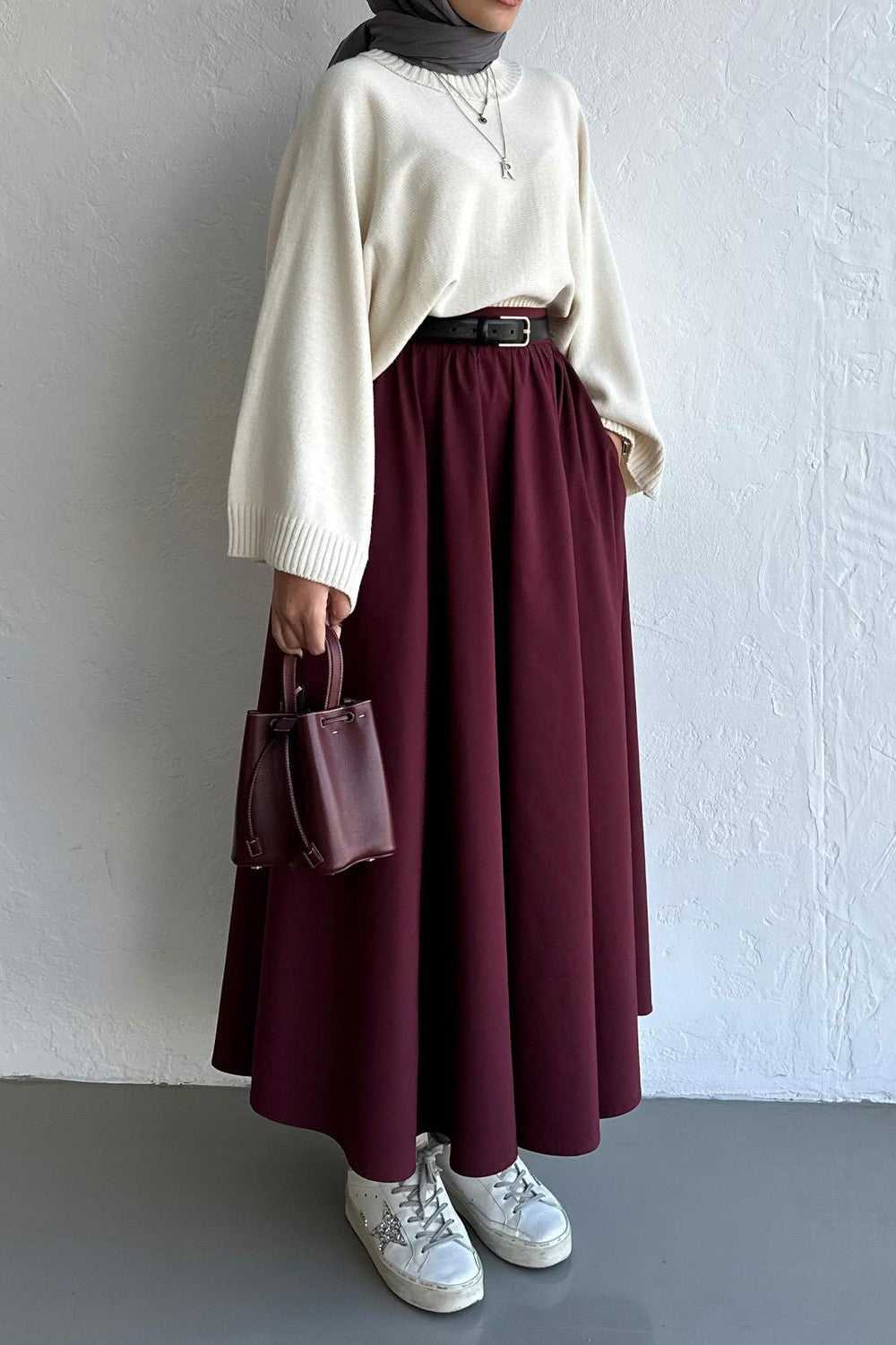 Cherianne.com burgundy flared poplin midi skirt with pockets, styled with a cream sweater and matching handbag