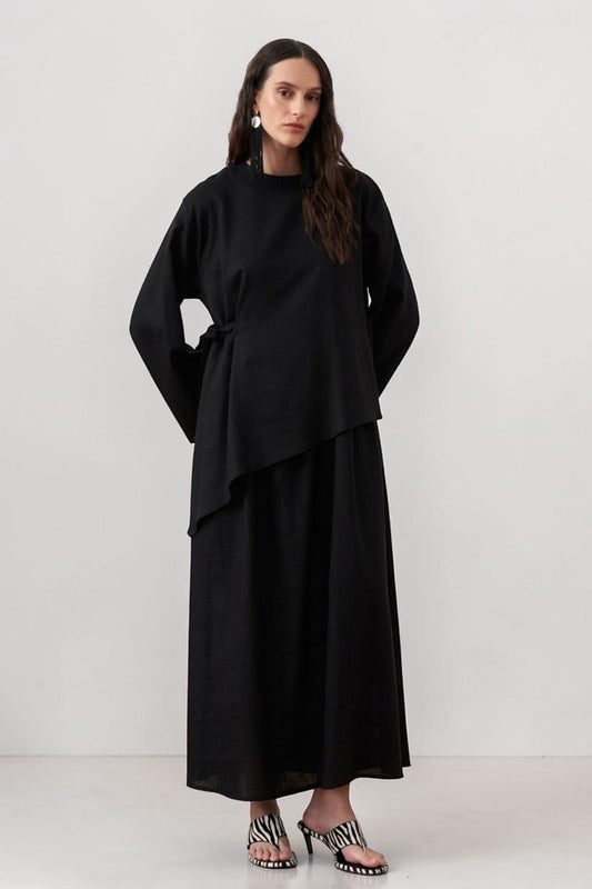 Cherianne.com black two-piece linen blend dress set featuring a sleeveless maxi dress and asymmetric side-tie tunic.