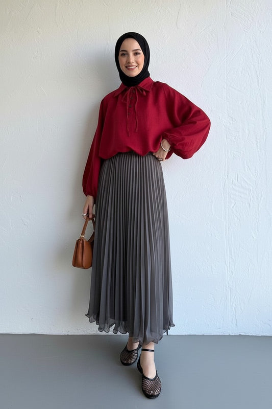 Cherianne.com grey pleated chiffon maxi skirt paired with a red long-sleeve blouse and black hijab